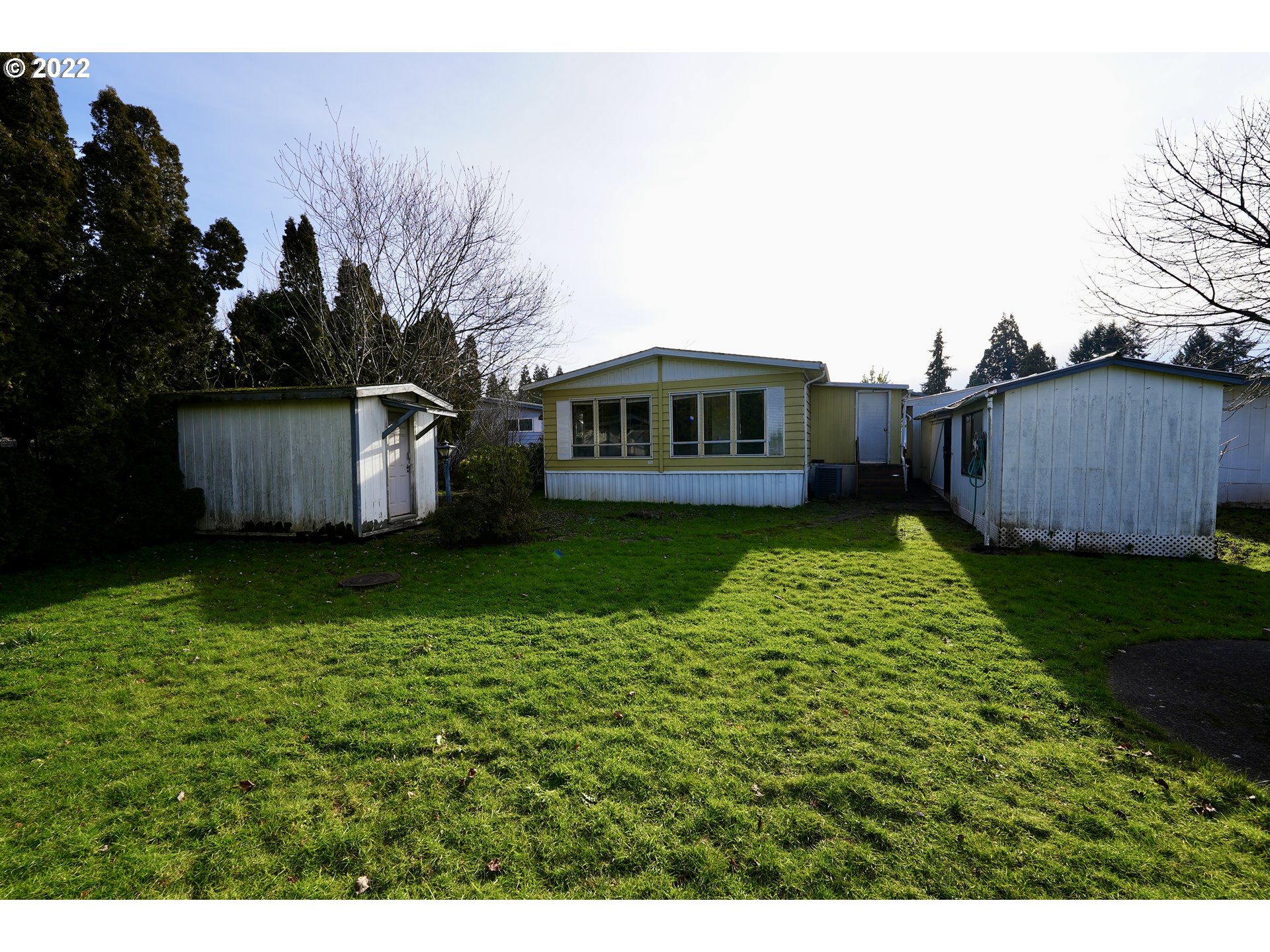 3530 Game Farm Road, Unit 11 Springfield, OR 97477 - Photo 18 of 27 a view of a house with backyard and sitting area