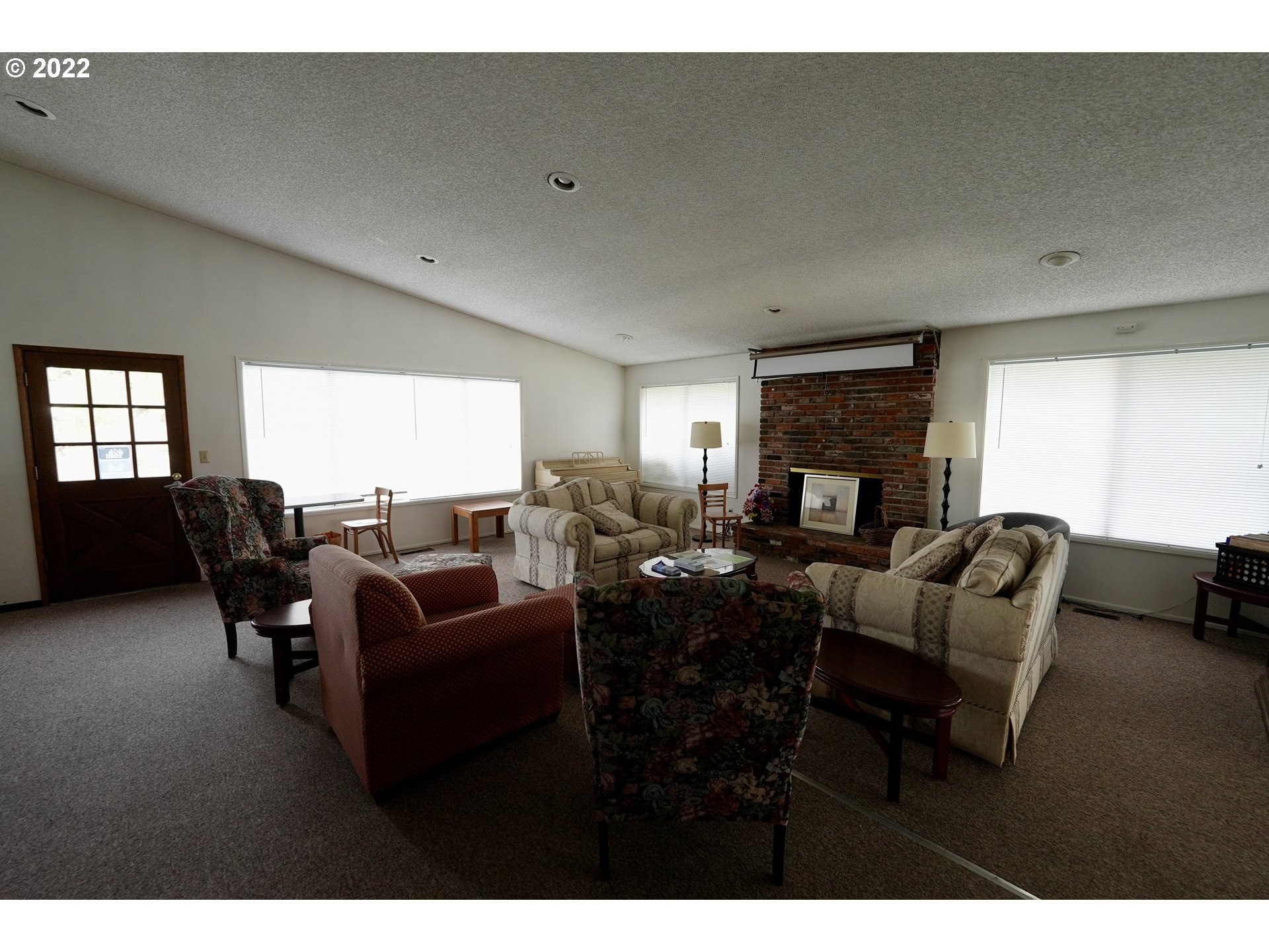 3530 Game Farm Road, Unit 11 Springfield, OR 97477 - Photo 22 of 27 a living room with furniture and a fireplace
