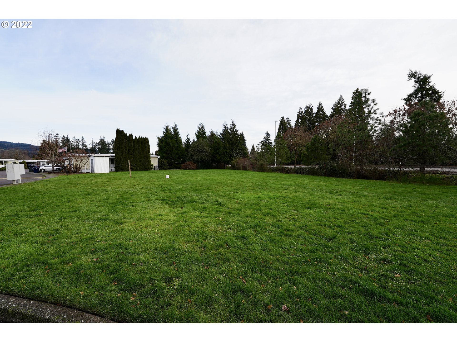 3530 Game Farm Road, Unit 11 Springfield, OR 97477 - Photo 26 of 27 a view of a field of grass and trees