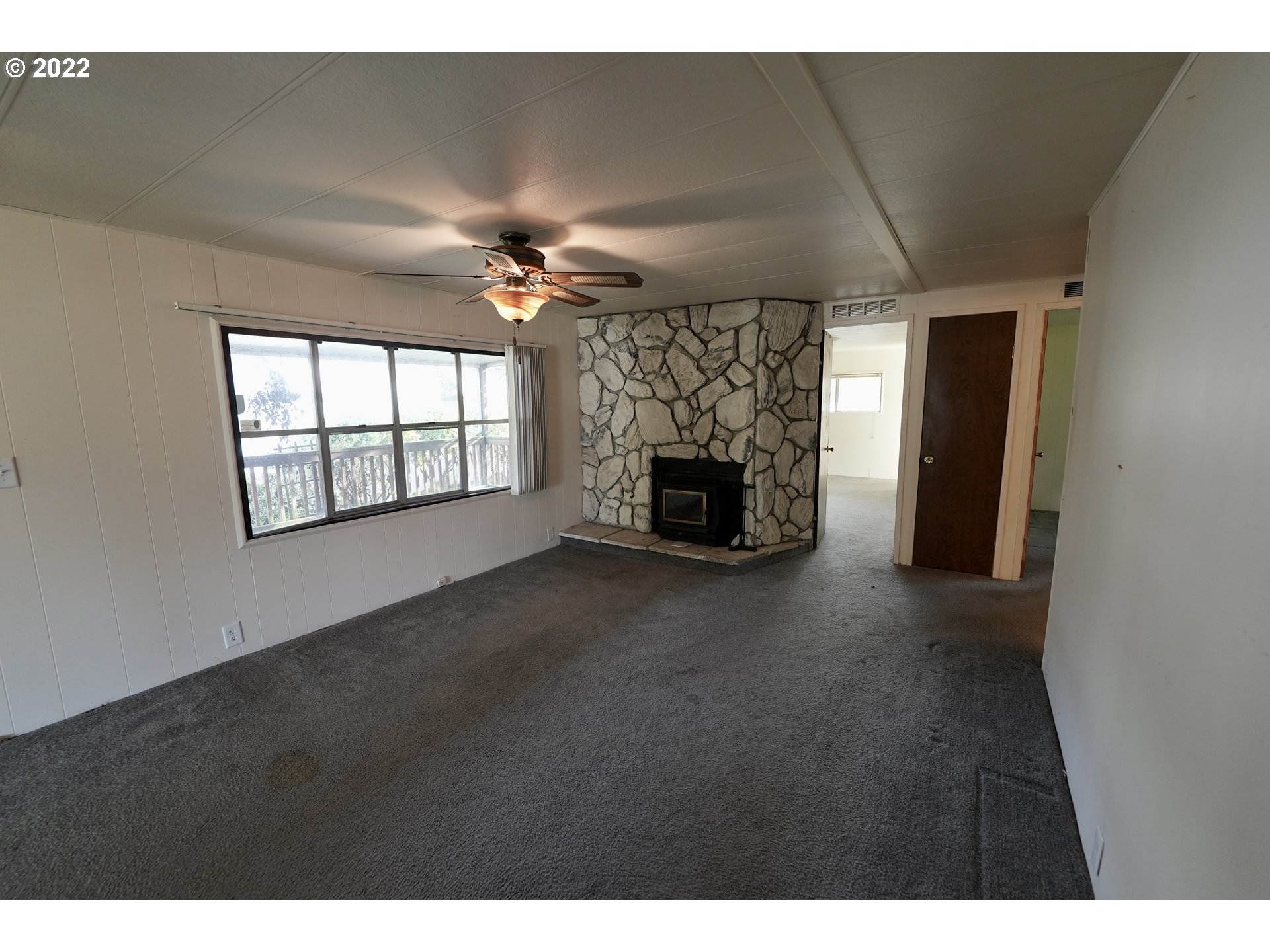 3530 Game Farm Road, Unit 11 Springfield, OR 97477 - Photo 3 of 27 a living room with furniture and a fireplace