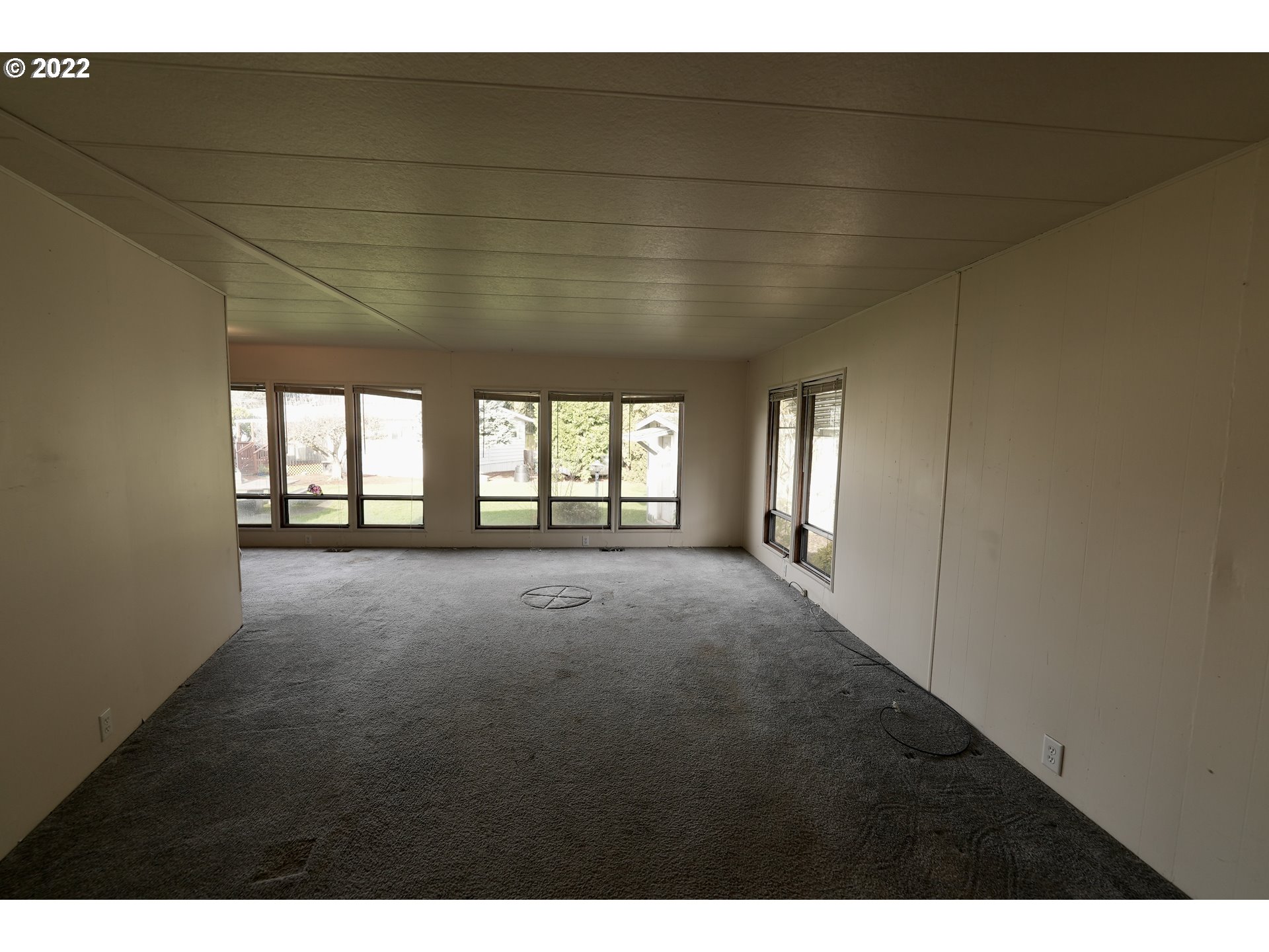 3530 Game Farm Road, Unit 11 Springfield, OR 97477 - Photo 4 of 27 a view of empty room with windows