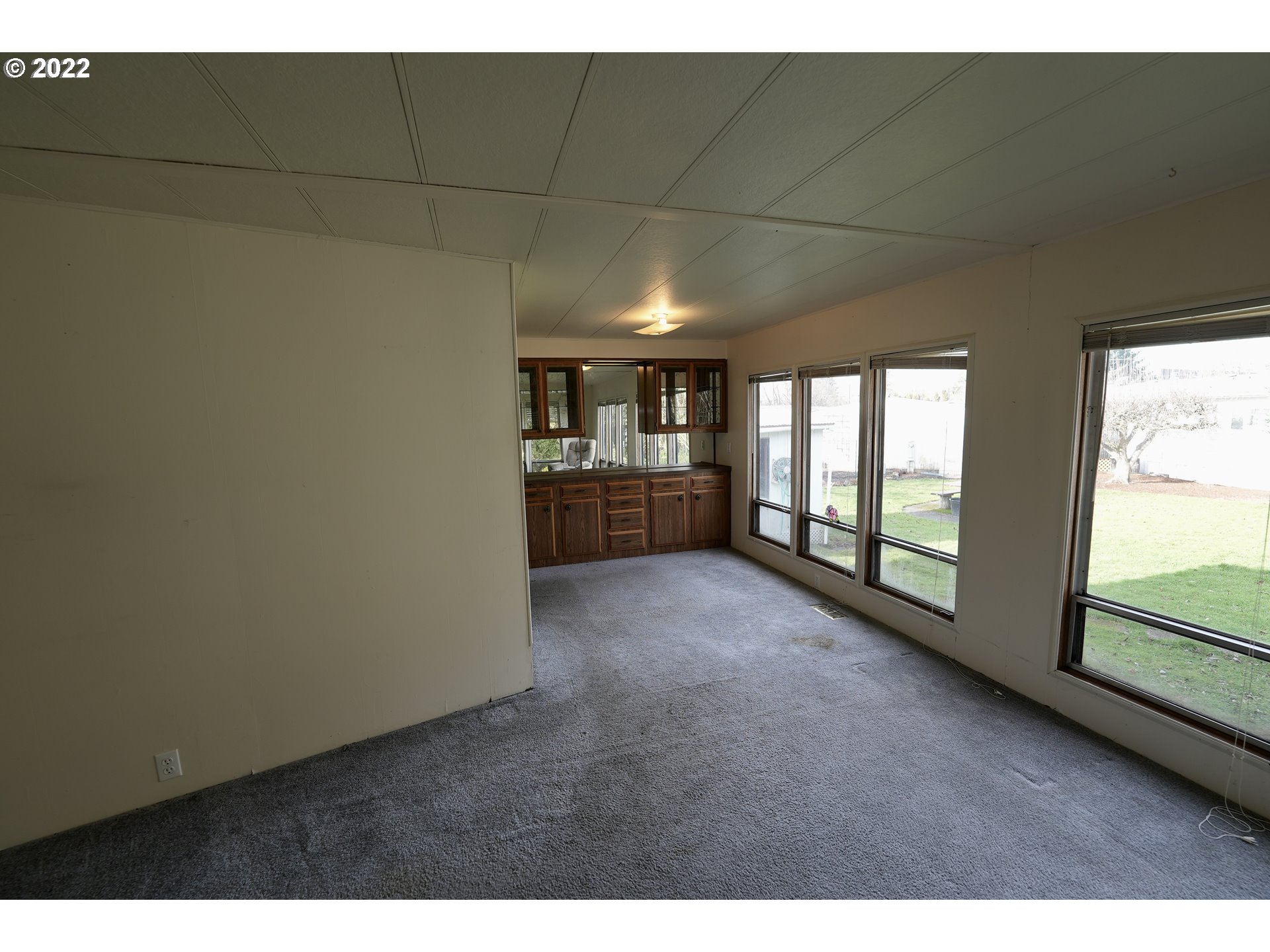 3530 Game Farm Road, Unit 11 Springfield, OR 97477 - Photo 5 of 27 a view of empty room with floor to ceiling window