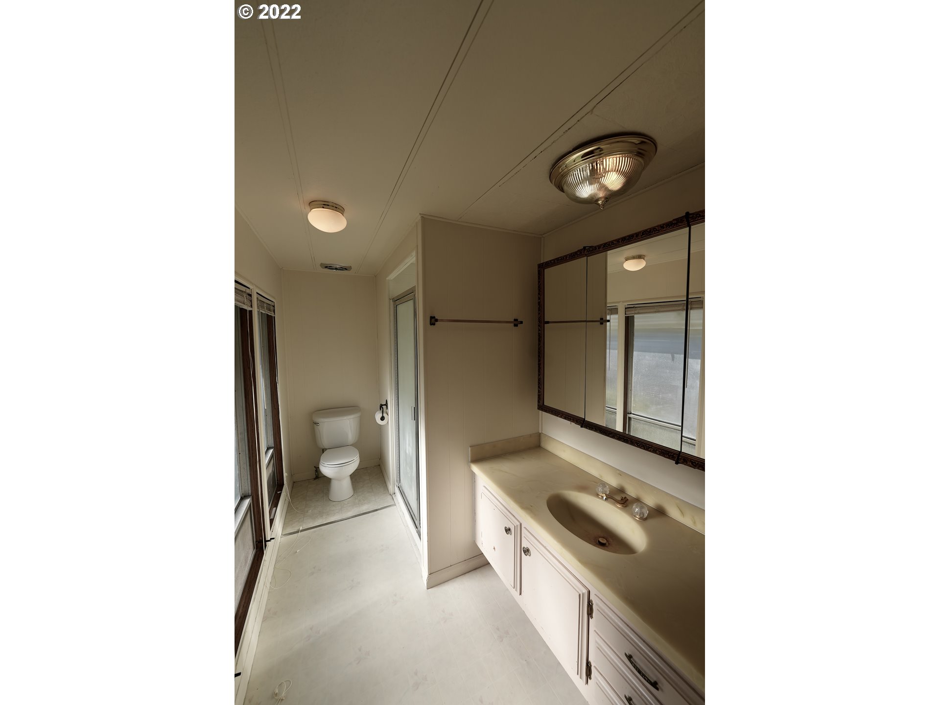 3530 Game Farm Road, Unit 11 Springfield, OR 97477 - Photo 10 of 27 a bathroom with a sink a toilet and a shower