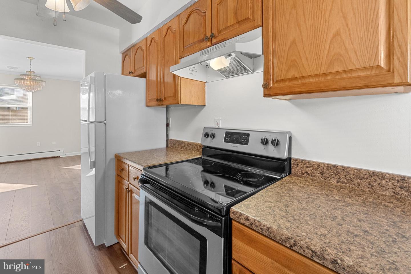 12814 Epping Terrace, Unit 2B Silver Spring, MD 20906 - Photo 13 of 28 Modern kitchen with warm wood accents.