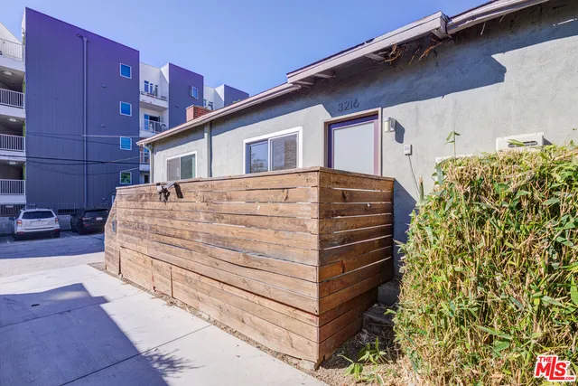 a tall building with a large window and shower
