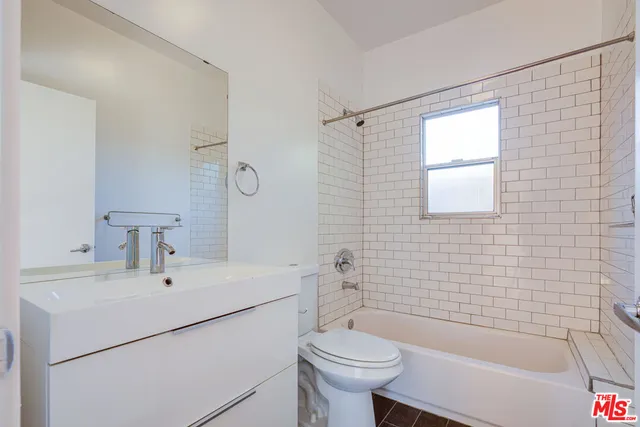 a bathroom with a sink toilet and bathtub
