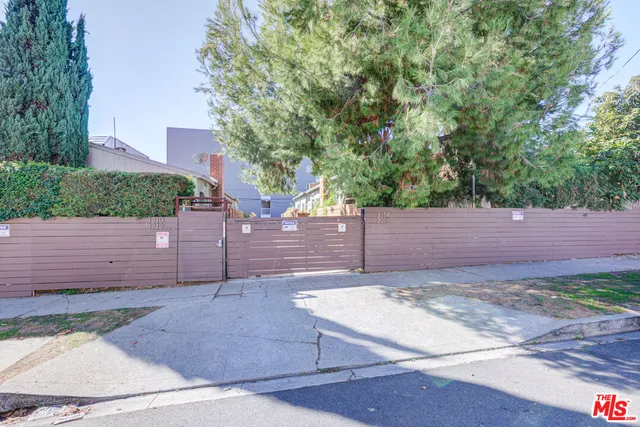 a view of a house with a tree