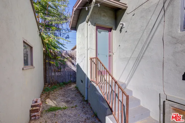 a view of a street with car parked