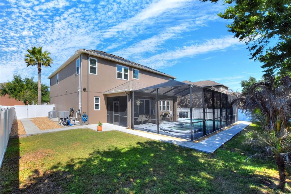 232 Magneta Loop Auburndale, FL 33823 - Photo 18 of 80 a front view of house with a garden and patio