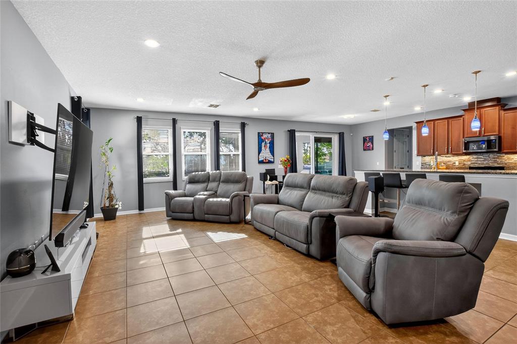 232 Magneta Loop Auburndale, FL 33823 - Photo 2 of 80 a living room with furniture and a flat screen tv