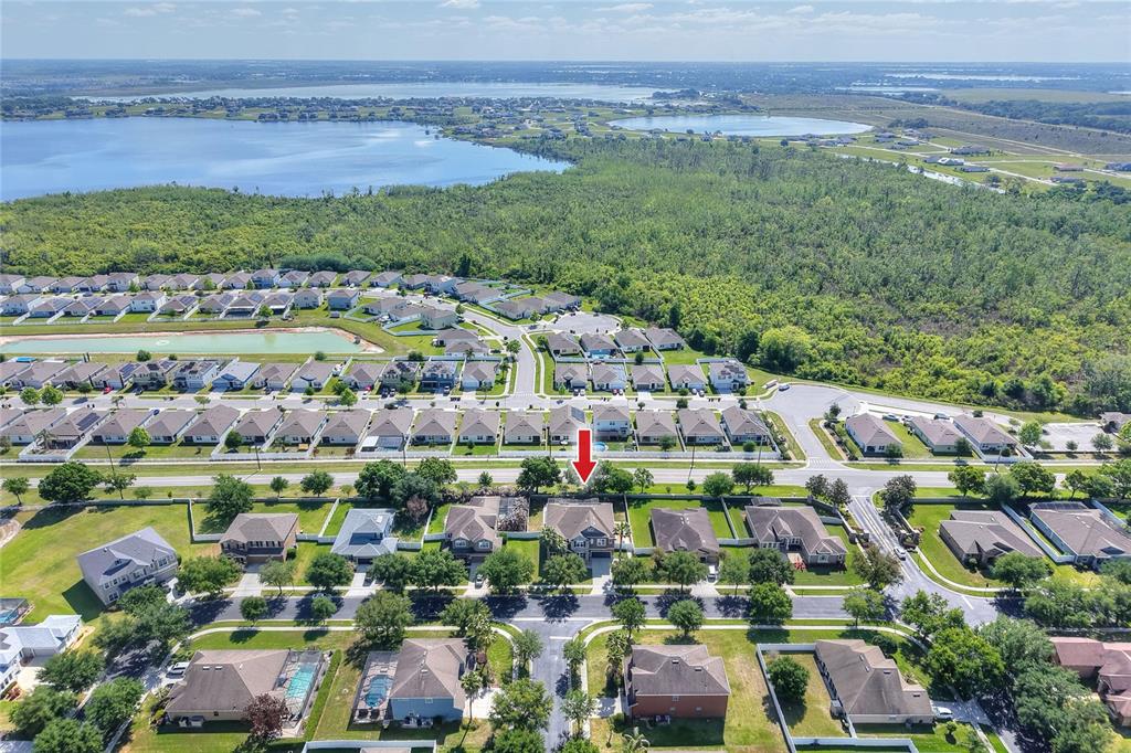 232 Magneta Loop Auburndale, FL 33823 - Photo 24 of 80 a view of multiple houses with yard and ocean view