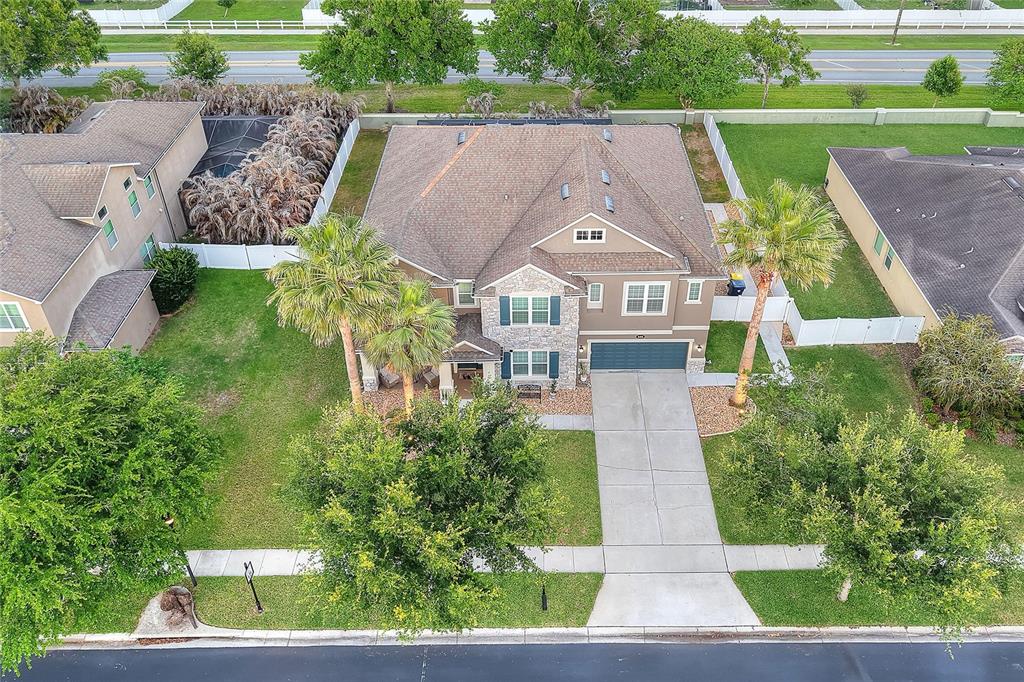 232 Magneta Loop Auburndale, FL 33823 - Photo 26 of 80 an aerial view of a house with a yard and potted plants