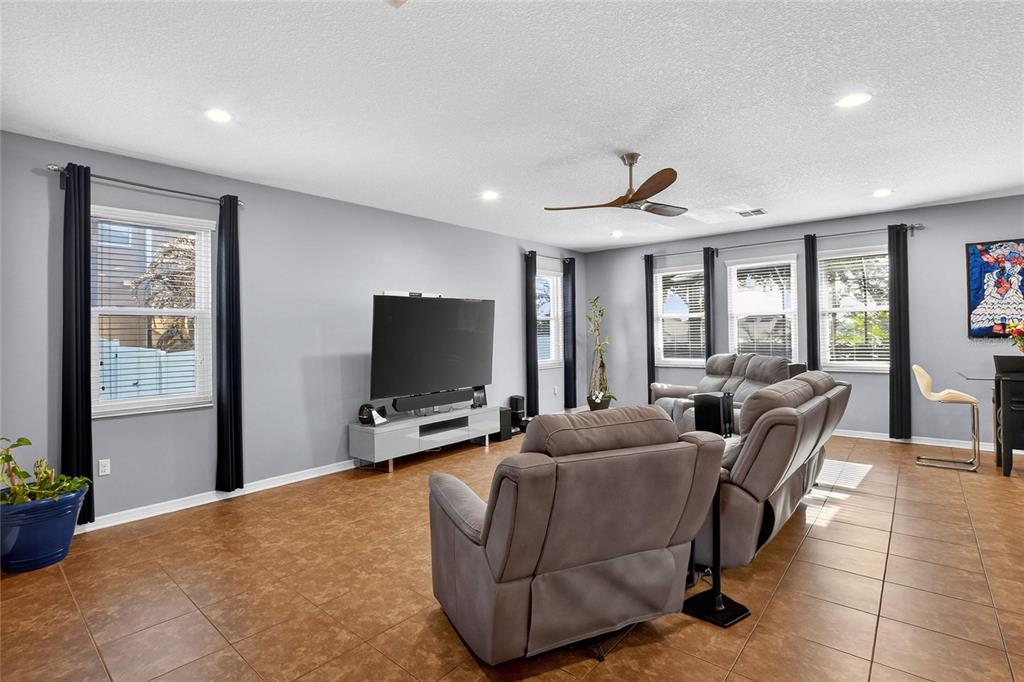 232 Magneta Loop Auburndale, FL 33823 - Photo 34 of 80 a living room with furniture and a flat screen tv