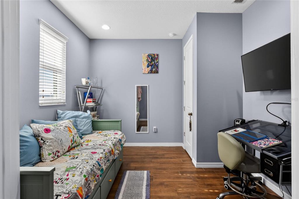 232 Magneta Loop Auburndale, FL 33823 - Photo 44 of 80 a bedroom with a bed and a flat screen tv