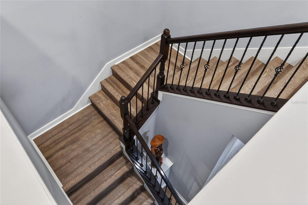 232 Magneta Loop Auburndale, FL 33823 - Photo 45 of 80 a view of staircase going to roof with wooden floor