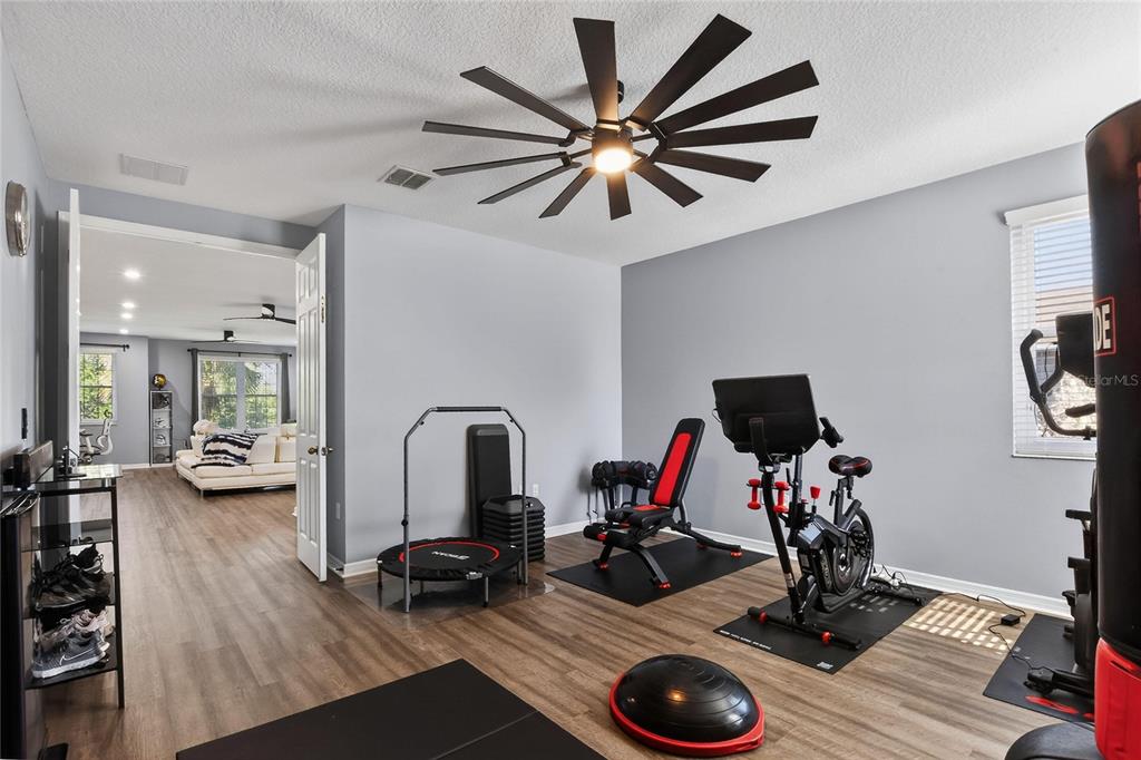 232 Magneta Loop Auburndale, FL 33823 - Photo 52 of 80 a view of a workspace with furniture and a flat screen tv