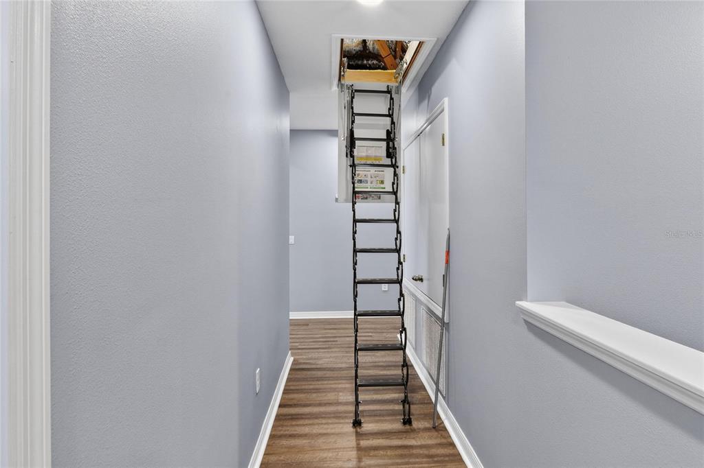 232 Magneta Loop Auburndale, FL 33823 - Photo 53 of 80 a view of a hallway with wooden floor and entryway