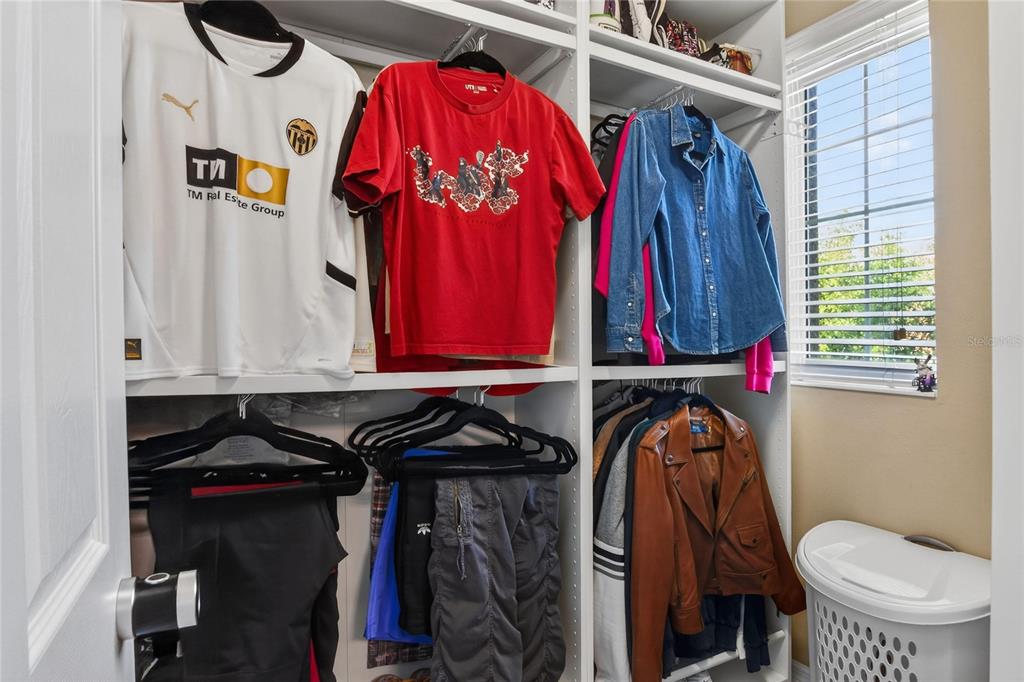 232 Magneta Loop Auburndale, FL 33823 - Photo 64 of 80 a view of walk in closet with clothes and shoes