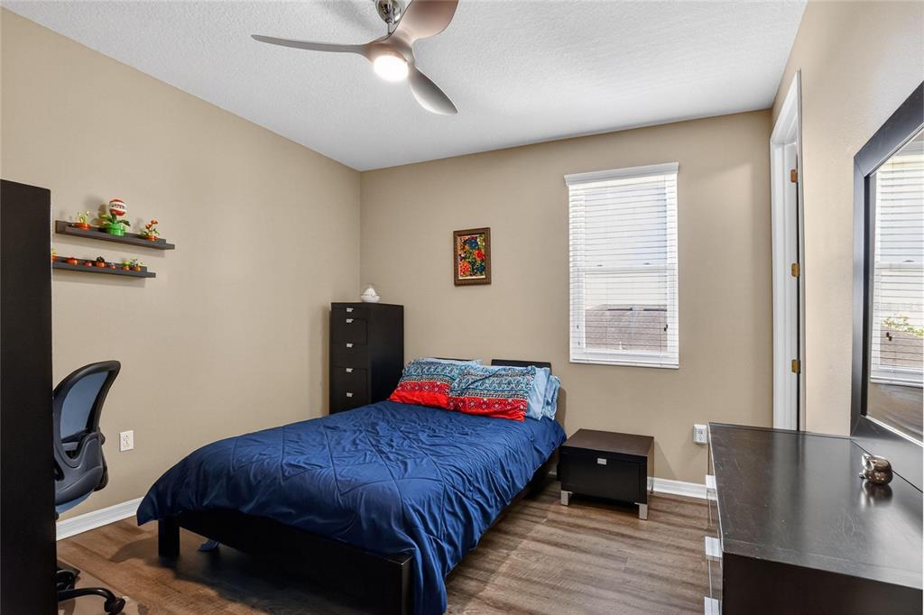 232 Magneta Loop Auburndale, FL 33823 - Photo 68 of 80 a bedroom with a bed and a window
