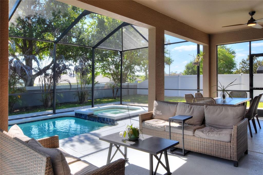 232 Magneta Loop Auburndale, FL 33823 - Photo 72 of 80 a view of a patio with couches and table under an umbrella