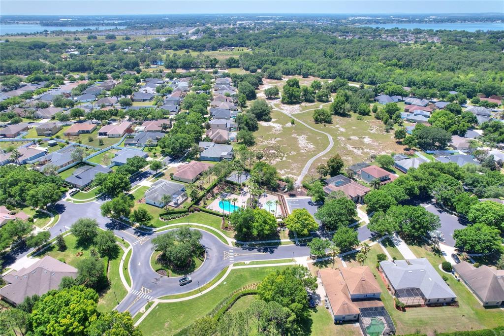 232 Magneta Loop Auburndale, FL 33823 - Photo 77 of 80 an aerial view of residential houses with outdoor space and trees