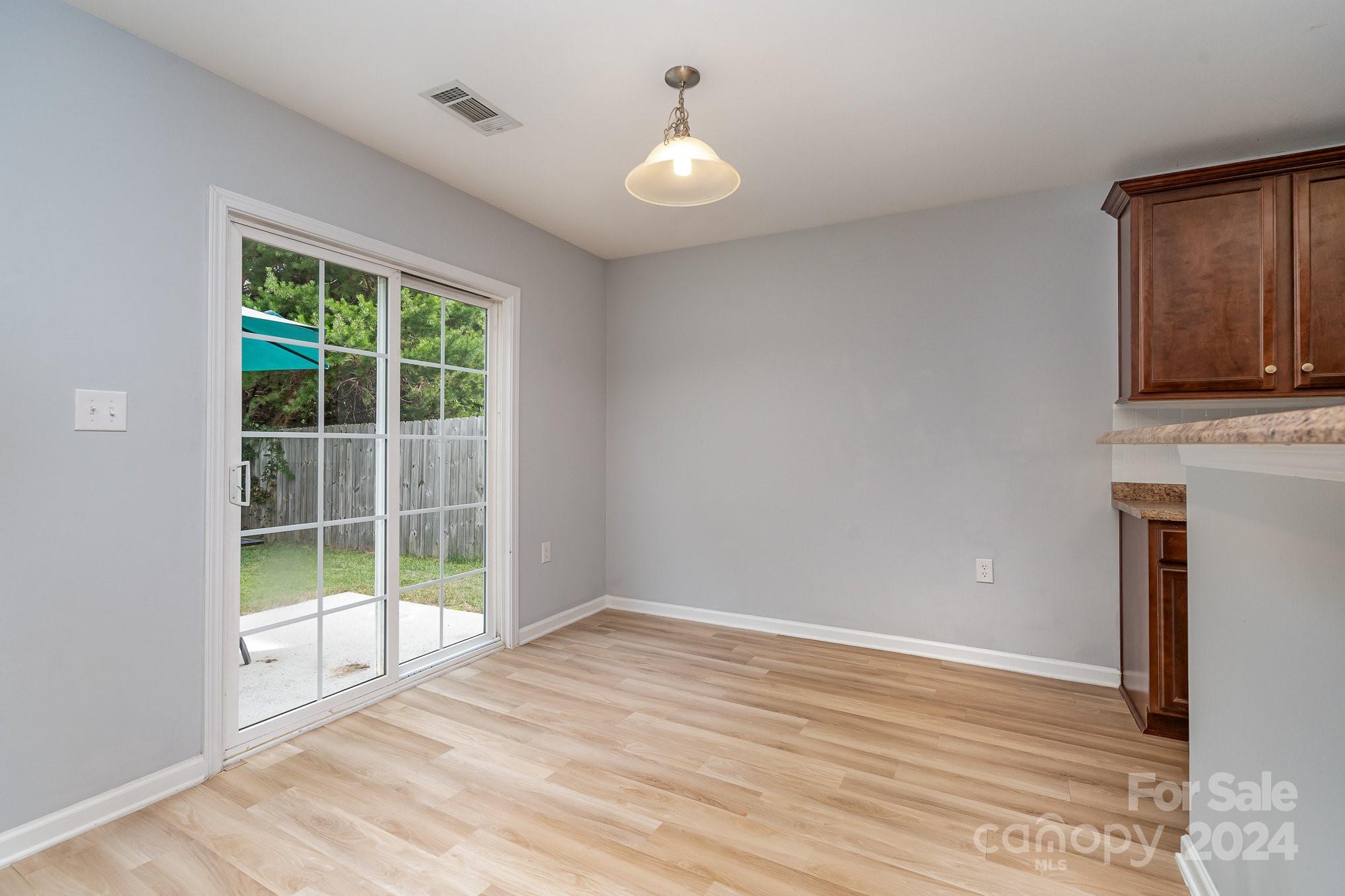 1004 Marcus Street Indian Land, SC 29707 - Photo 15 of 48 a view of empty room with wooden floor and fan
