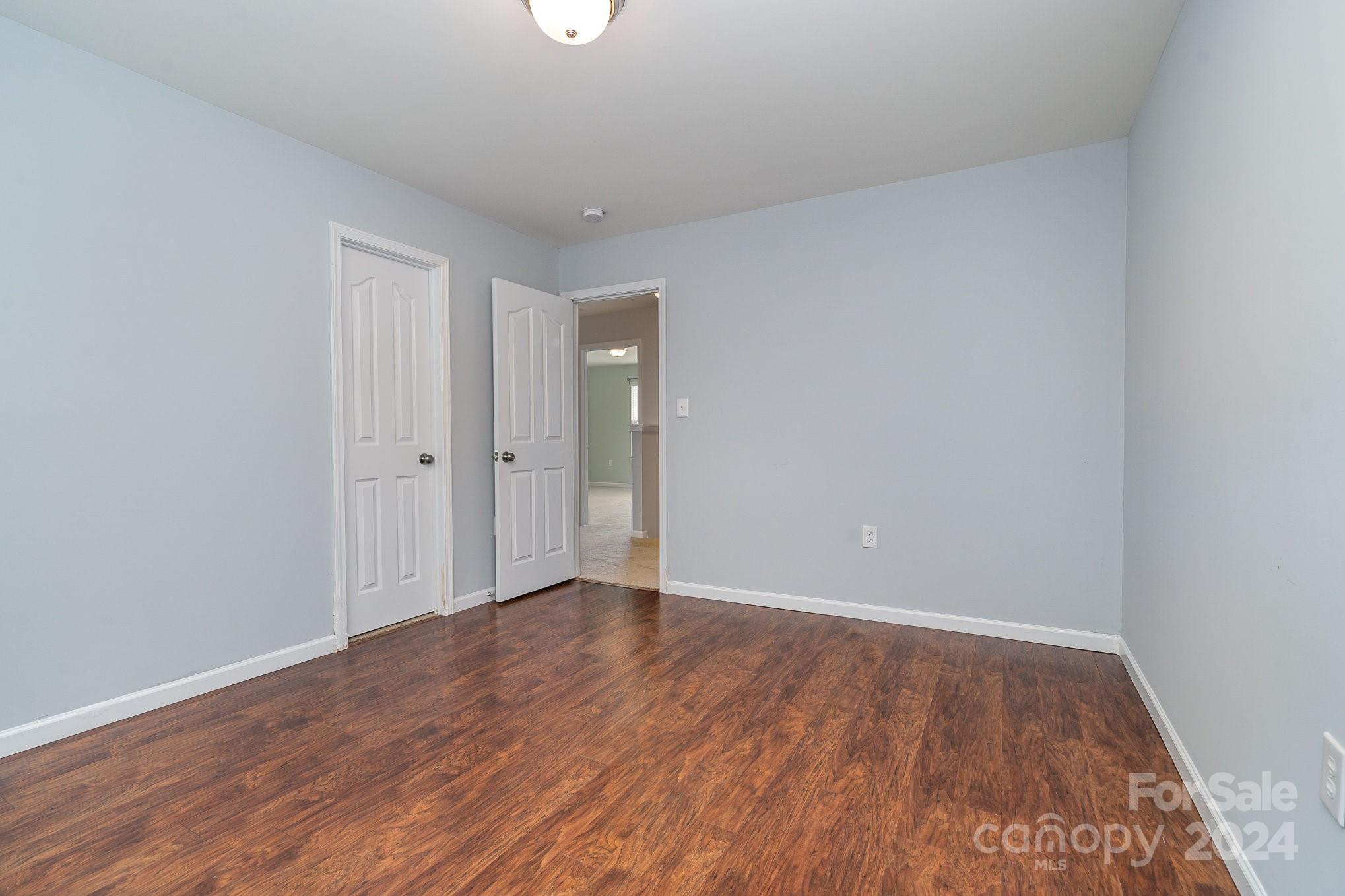 1004 Marcus Street Indian Land, SC 29707 - Photo 23 of 48 a view of an empty room and wooden floor