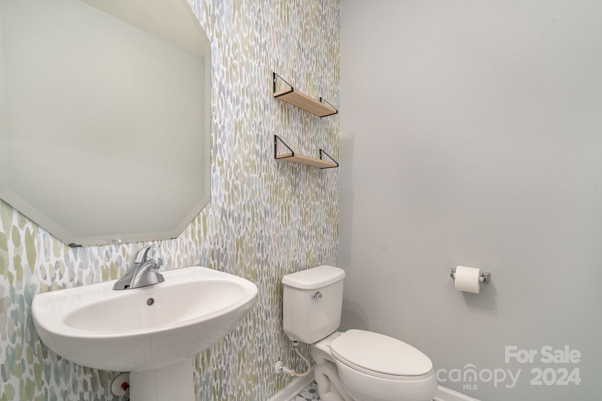 1004 Marcus Street Indian Land, SC 29707 - Photo 25 of 48 a bathroom with a sink a toilet and shower