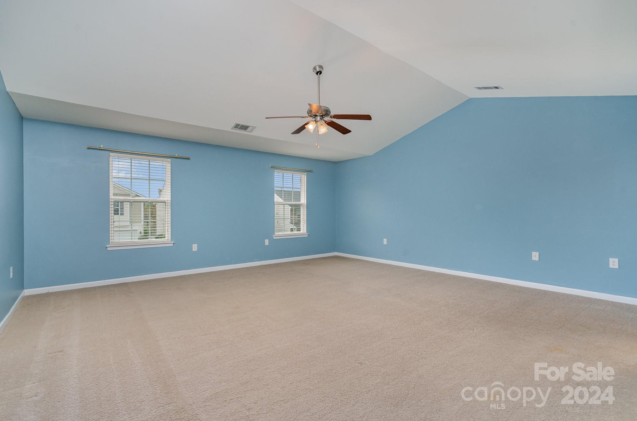 1004 Marcus Street Indian Land, SC 29707 - Photo 26 of 48 a view of a room with windows and ceiling fan