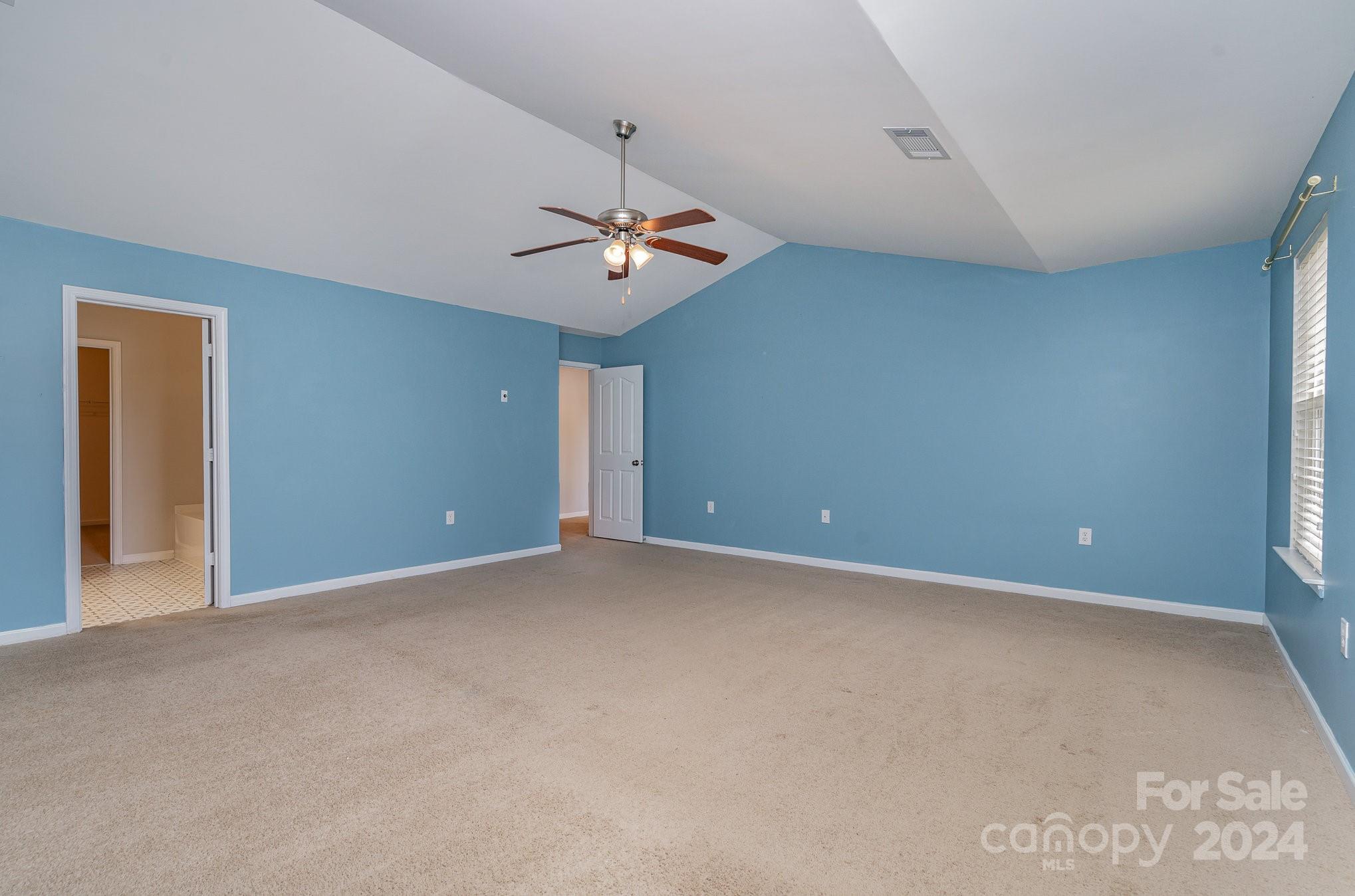 1004 Marcus Street Indian Land, SC 29707 - Photo 28 of 48 a view of an empty room with a chandelier fan