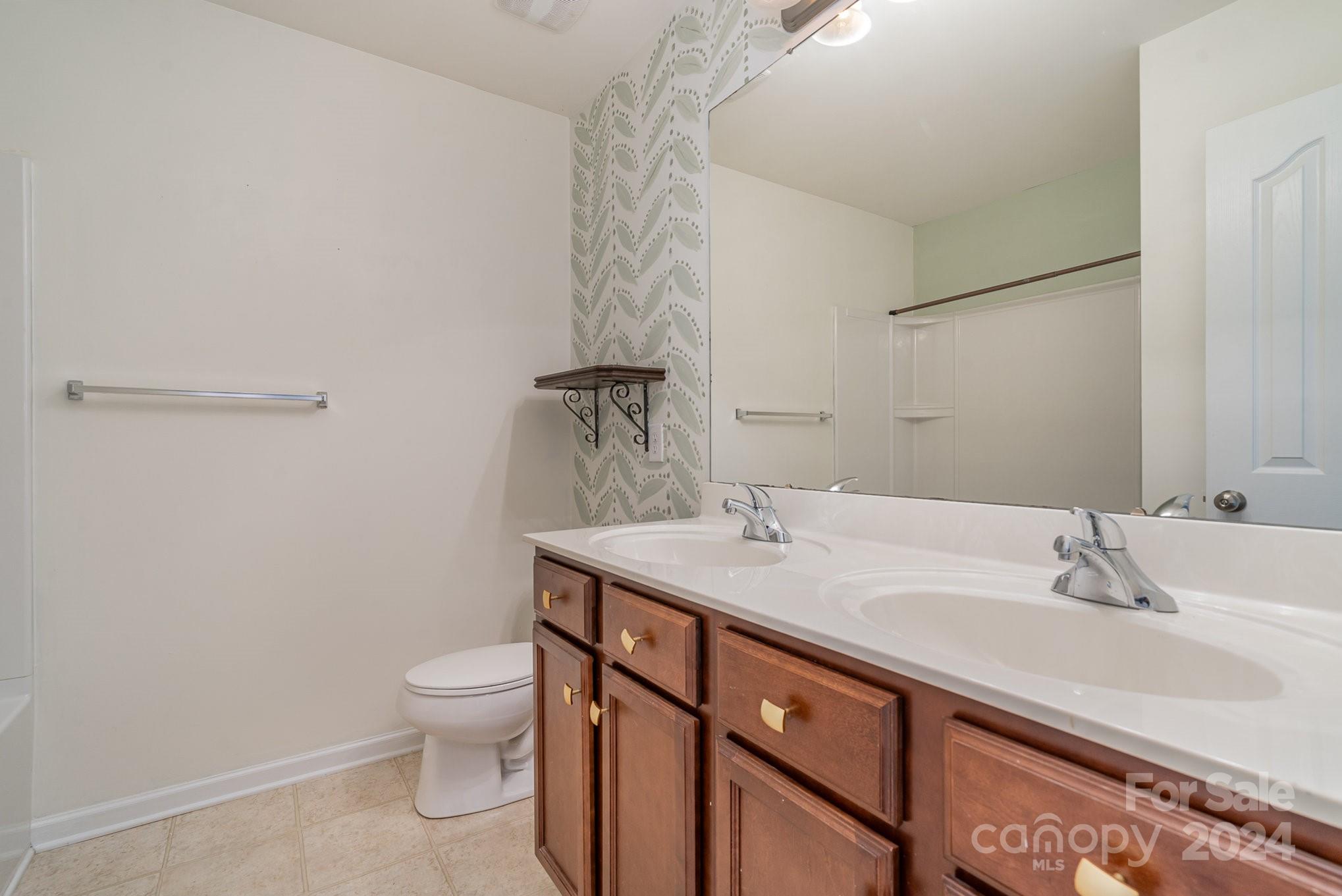 1004 Marcus Street Indian Land, SC 29707 - Photo 39 of 48 a bathroom with a sink toilet and vanity
