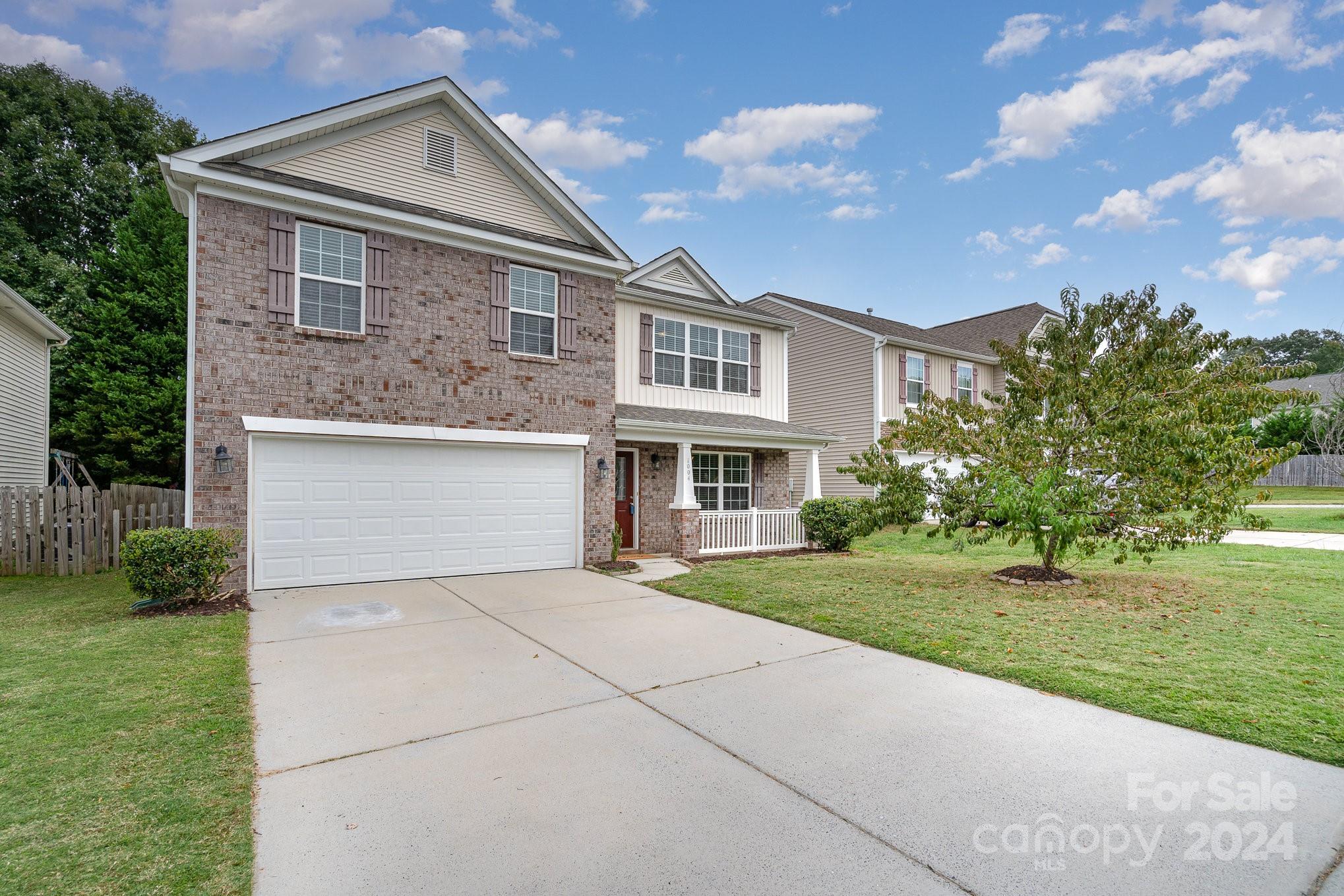 1004 Marcus Street Indian Land, SC 29707 - Photo 4 of 48 a front view of house with yard and green space