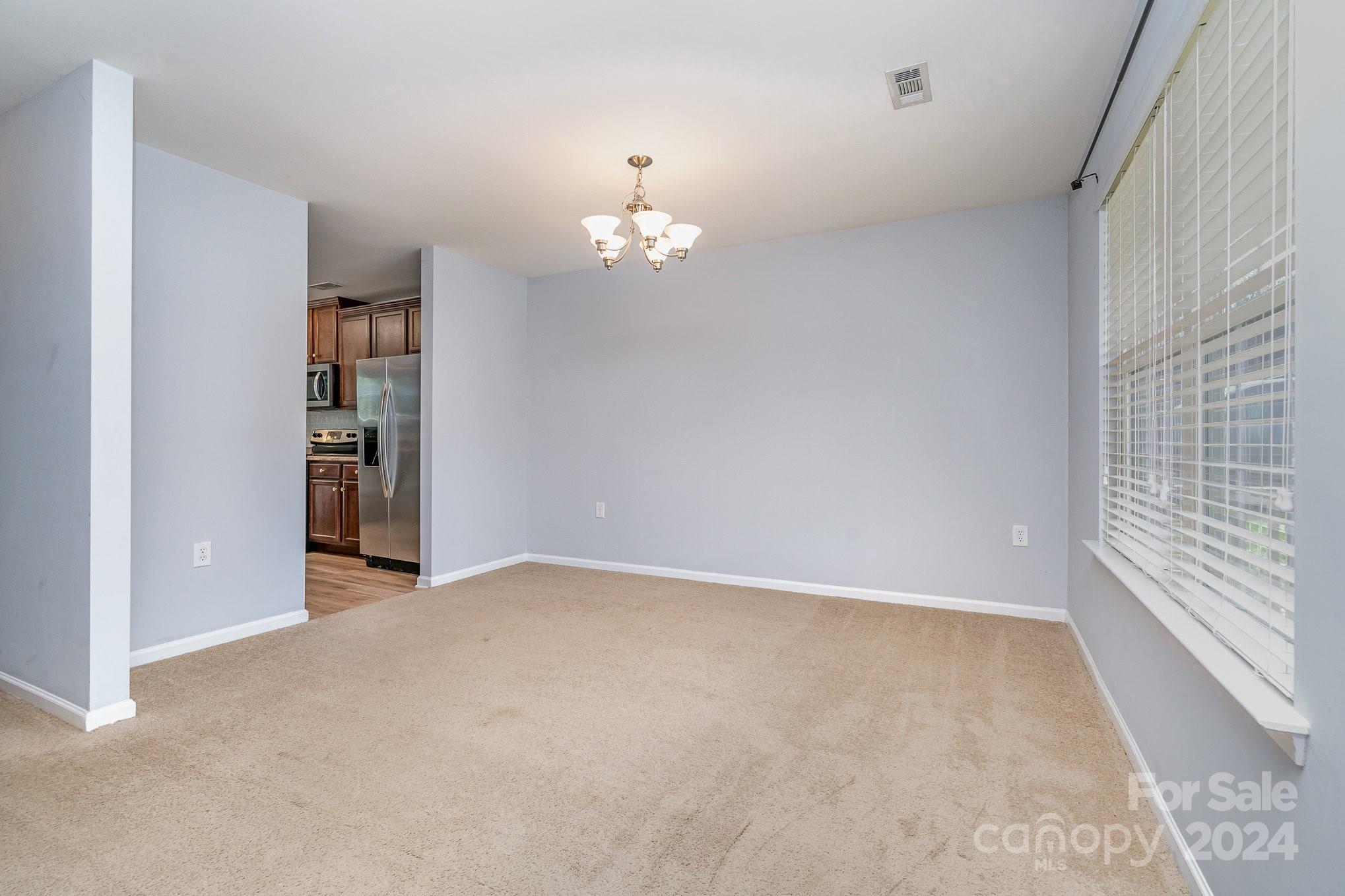 1004 Marcus Street Indian Land, SC 29707 - Photo 7 of 48 wooden floor in an empty room with a window