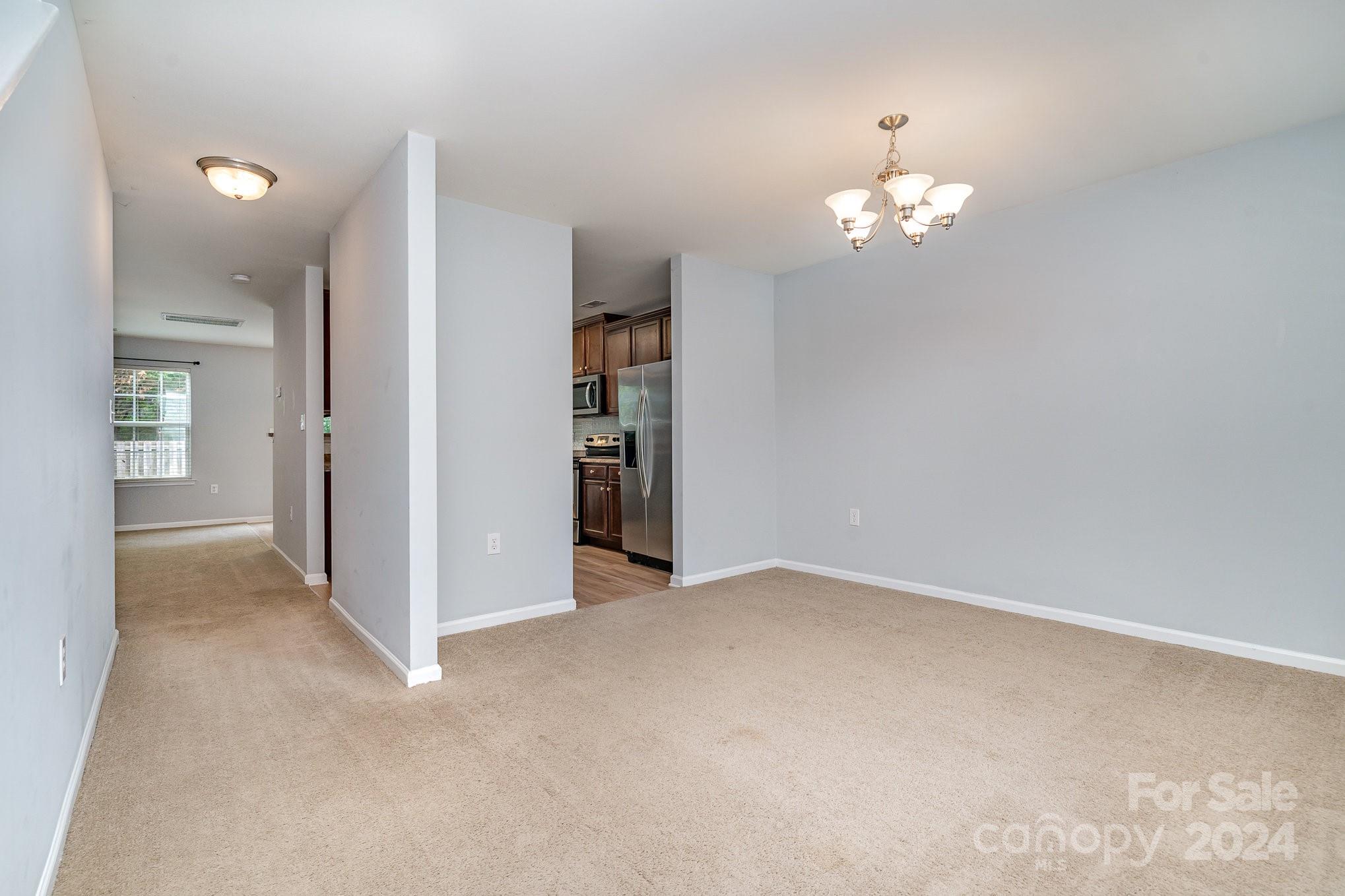 1004 Marcus Street Indian Land, SC 29707 - Photo 8 of 48 wooden floor in an empty room with a window
