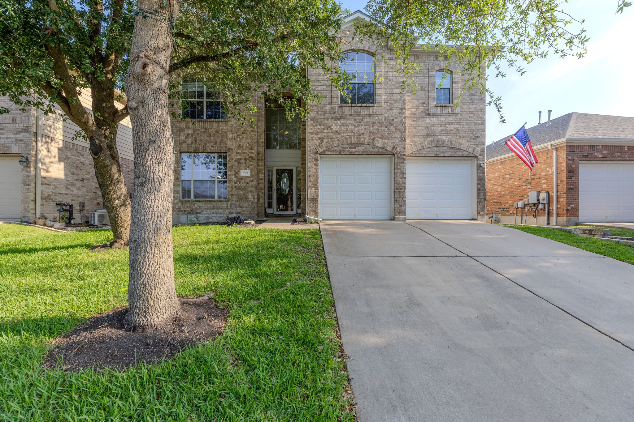 3517 Shiraz Loop Round Rock, TX 78665 - Photo 2 of 40 Brick exterior with arched garage openings
