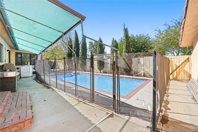 a living room with fireplace furniture and a potted plant