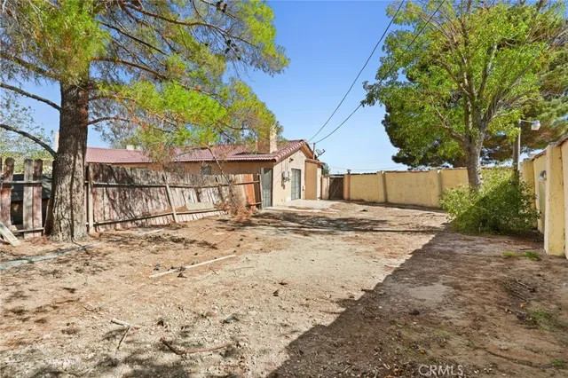a bedroom with a large bed and a dresser