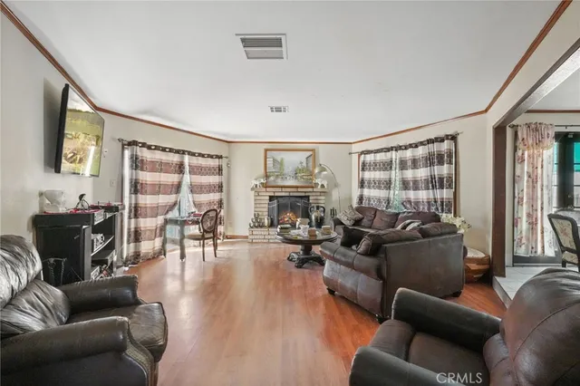 a utility room with lots of clutter and cabinets