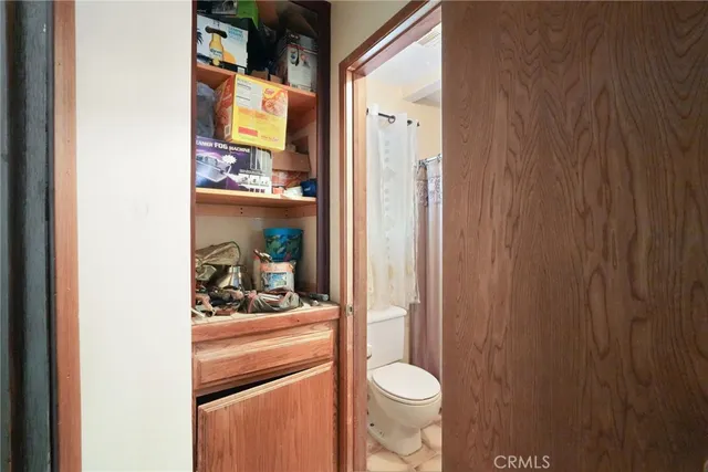 a bedroom with a bed and a table