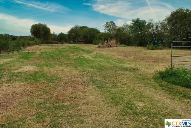 a view of outdoor space with deck and yard