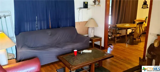 a living room with furniture and a table
