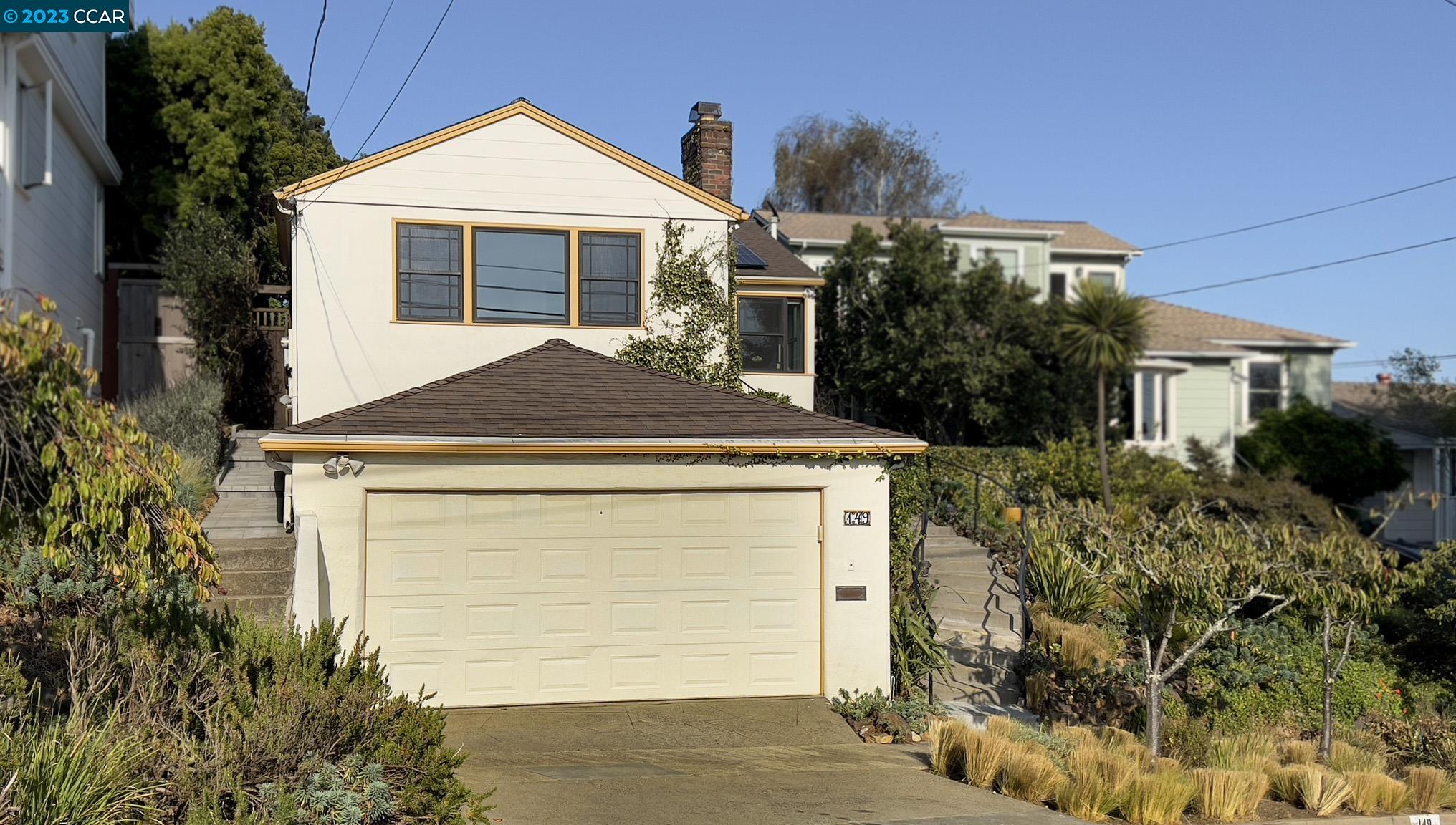 149 Purdue Avenue Kensington, CA 94708 - Photo 1 of 1 a view of a house with a yard and potted plants