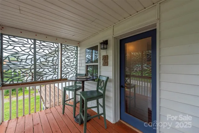a view of a balcony with furniture