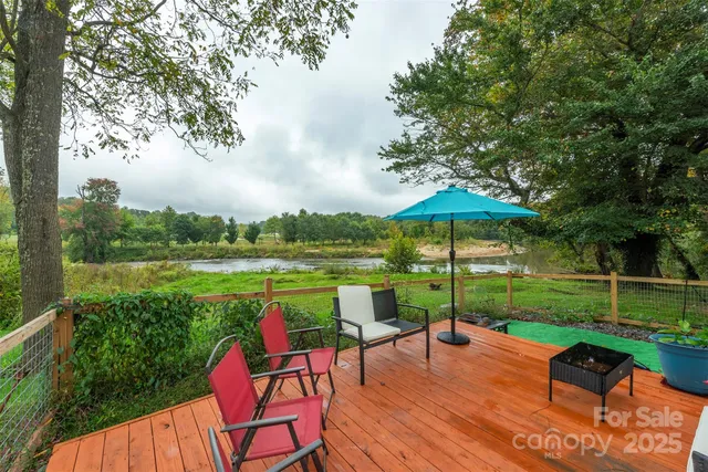 a view of a chair and table on the garden