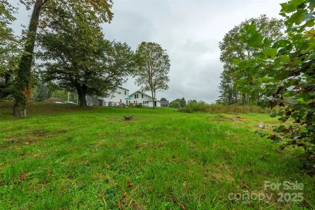 a view of a lake with houses in the back