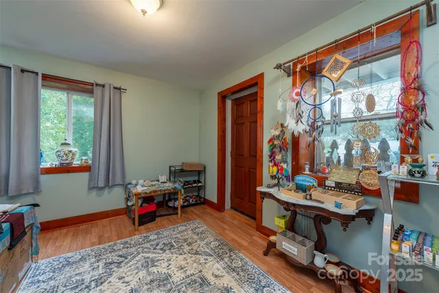 a living room with blue lights with furniture