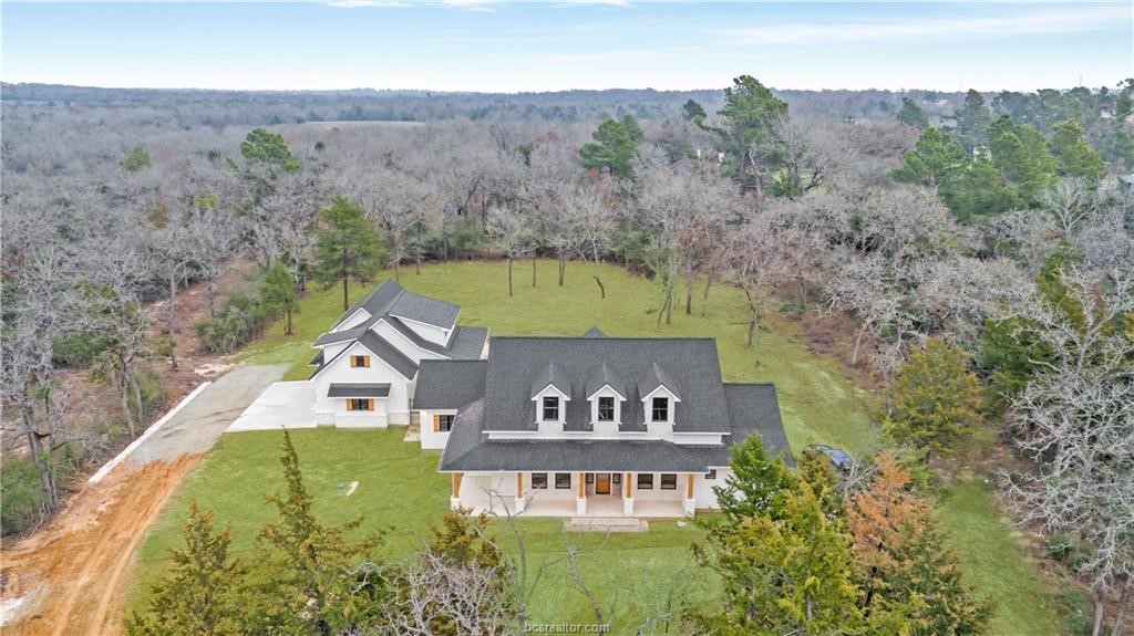 Lot 9 Old Hickory Trail Franklin, TX 77856 - Photo 1 of 41 an aerial view of a house swimming pool and mountains