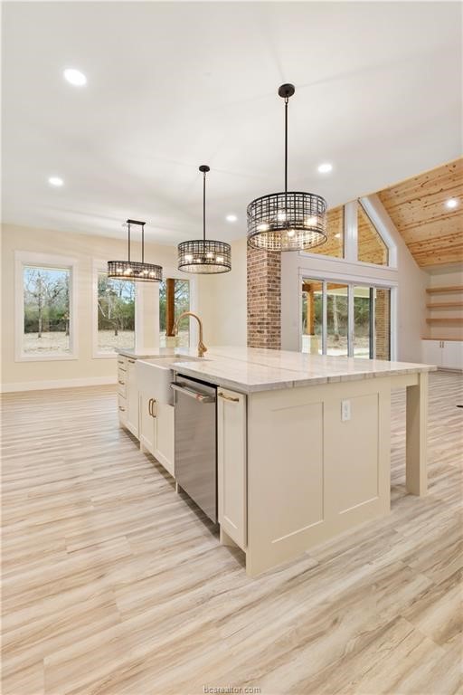 Lot 9 Old Hickory Trail Franklin, TX 77856 - Photo 18 of 41 a kitchen with stainless steel appliances kitchen island granite countertop a stove and a wooden floors