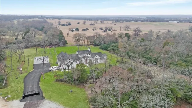 an aerial view of a house with a garden