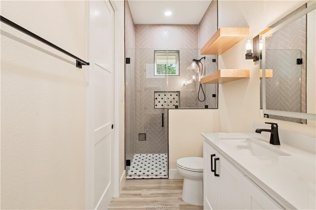 Lot 9 Old Hickory Trail Franklin, TX 77856 - Photo 23 of 41 a bathroom with a sink a toilet and shower